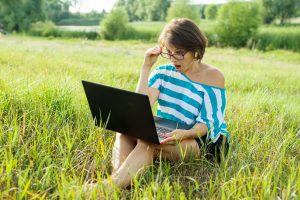surprised woman looks at laptop monitor woman fre 2022 05 30 23 25 36 utc